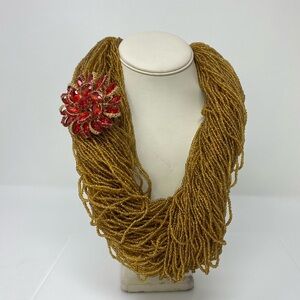 Elegant Gold Beaded Necklace with Red Floral Accent